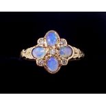 An Edwardian 9 carat gold flower form cluster ring set opals and diamonds, 2.7g, size L