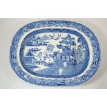 An Edwardian blue and white large turkey plate with gravy well