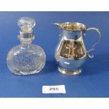 A silver baluster cream jug, London 1897, 118g and a cut glass perfume bottle with silver collar,