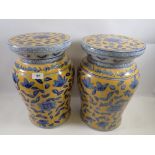 A pair of Chinese blue and yellow floral jardinière stands or stools, 40cm