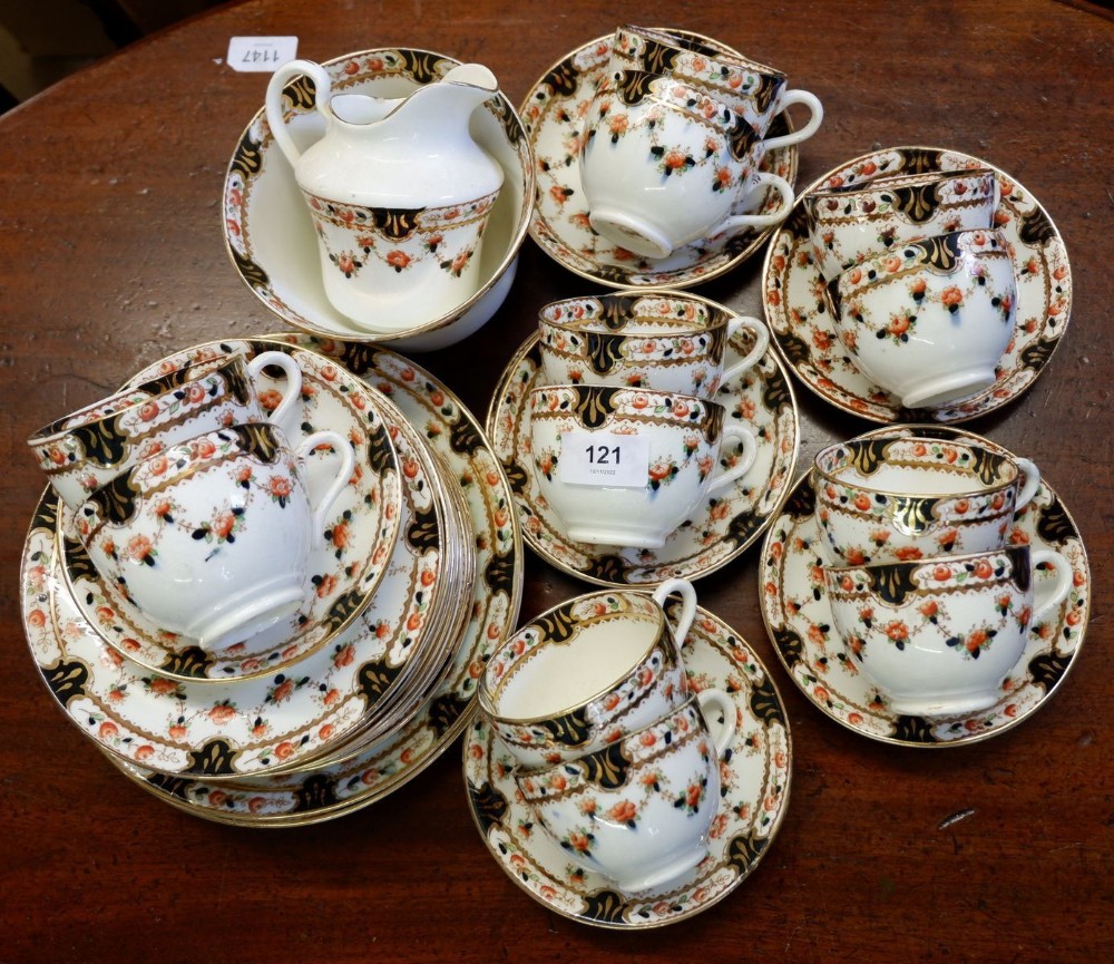 An Edwardian Osbourne China tea service comprising: twelve tea cups and eleven saucers, twelve tea