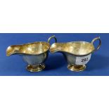 A pair of small silver sauce boats, Sheffield 1916 by Thomas Bradbury & Sons, 135g