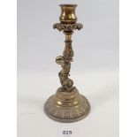 A 19th century cast brass dolphin candlestick, 22cm tall