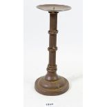 A cast iron reeded candlestick, 25.5cm tall