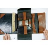 A gentleman's ebony vintage toiletry set in leather case