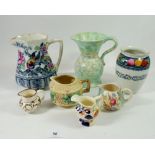 A Losol Ware floral jug, five various other jugs and a toothbrush mug