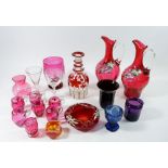 A pair of floral painted glass liqueur decanters and six miniature tankards and various other