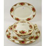 A Royal Albert dinner service comprising: two covered tureens, one oval serving dish, twenty