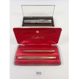 A Parker 61 gold plated fountain pen and pencil, boxed and a Parker 25 set