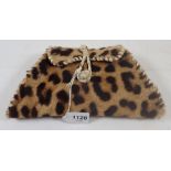A vintage leopard skin purse