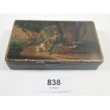 A 19th century small tin painted huntsman and dog to lid, 11.5 x 7cm