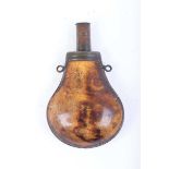 A brass bound pear shaped powder flask in burr fruitwood with twin suspension rings and brass cap