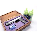 UHC BB pistol in wooden case, with approx. 4000 plastic BBs