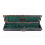 An unusual vintage steel gun transport case with green baize lined fitted interior for 30 ins