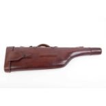 A vintage oxblood leather leg o' mutton gun case for up to 30 ins barrels, and another canvas leg