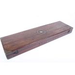 Mahogany gun case with brass corners, end inset brass handle and centre mounted inset brass ring