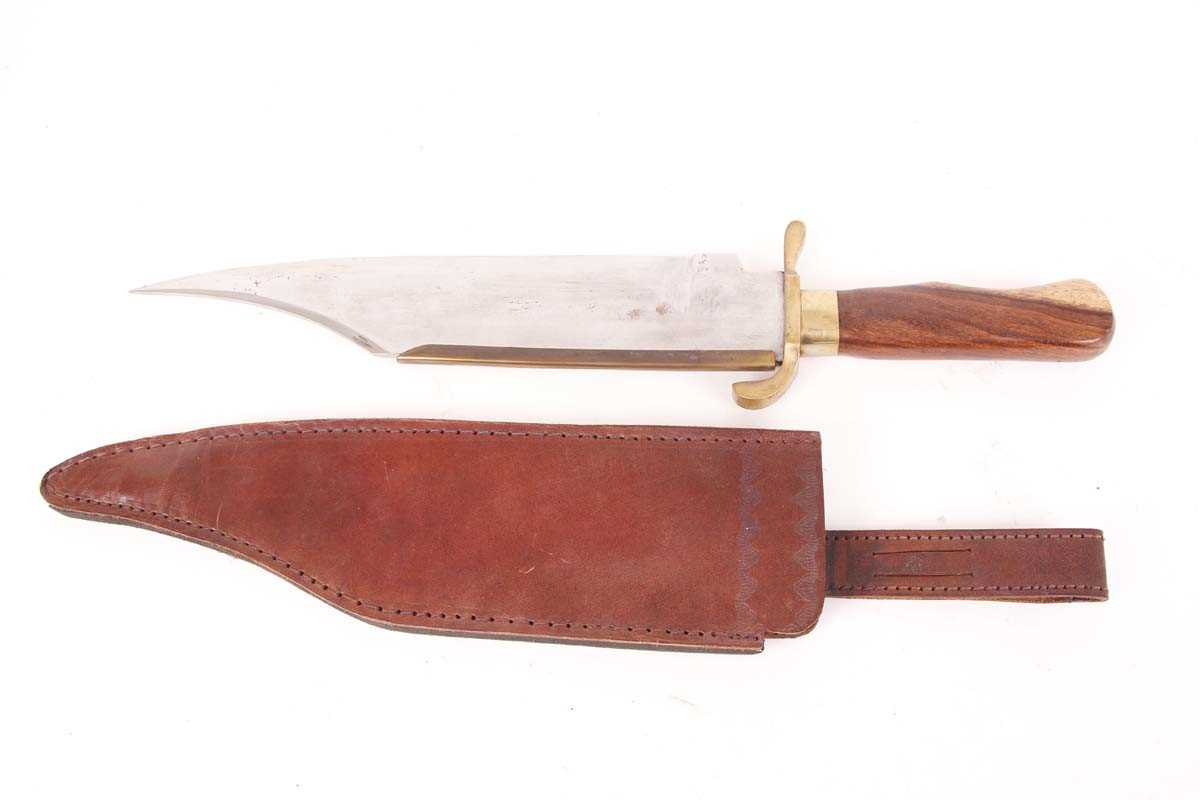 Alamo type bowie knife, 13 ins brass-backed blade, brass guard, wood grips, in leather sheath