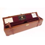 Oak and leather box gun case, purple baize lined fitted interior for 27 ins barrels, Holland &