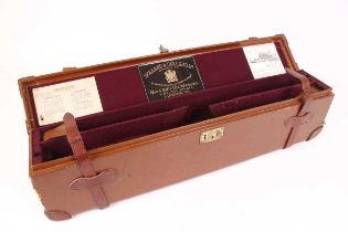 Oak and leather box gun case, purple baize lined fitted interior for 27 ins barrels, Holland &
