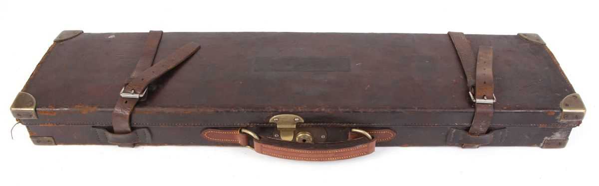 Leather gun case with brass corners, fitted green baize interior for 28 ins barrels and W.J. Jeffery