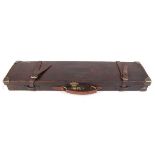 Leather gun case with brass corners, fitted green baize interior for 28 ins barrels and W.J. Jeffery