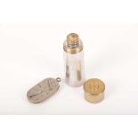 A vintage French game counter, together with a pewter and brass drinking flask in the form of a