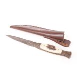 Damascus steel stiletto dagger, 4 ins blade, metal and horn grips, in leather sheath, overall 8½