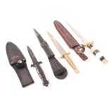 Fairbairn Sykes type fighting knife in sheath, MTech stiletto dagger in sheath, and one other