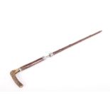 (S58) A 7mm walking stick shotgun, 22½ ins barrel with bamboo covered outer with alloy mounts,