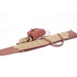 Canvas and leather padded shotgun slip together with a red canvas and leather cartridge bag (2)