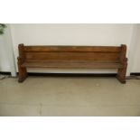 A large Victorian heavy pew, 259cm wide, with some evidence of woodworm