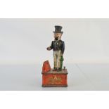 A reproduction cold painted cast iron money bank, Uncle Sam, 28cm high.