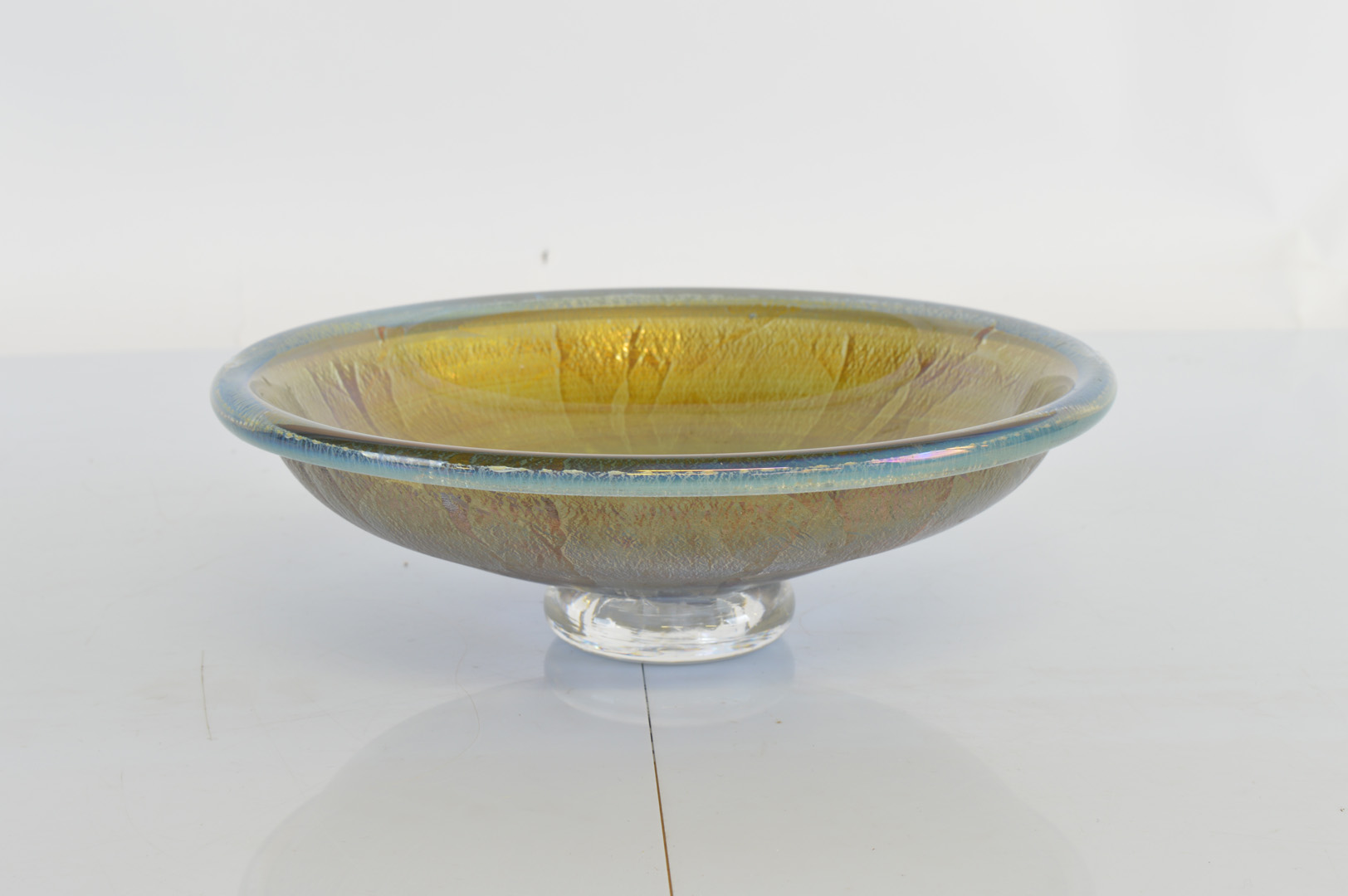 A contemporary footed glass bowl, by Stuart Fletcher, the circular bowl decorated with textured foil