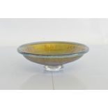 A contemporary footed glass bowl, by Stuart Fletcher, the circular bowl decorated with textured foil
