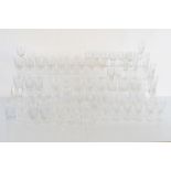 A collection of cut and frosted glassware, including eight red wine glasses, ten wine glasses with
