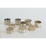 A collection of napkin rings, including seven silver and two plated examples (9)