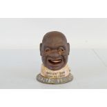 A reproduction cast iron money bank, Smilin' Sam From Alabam The Salted Peanut Man 16cm high.
