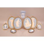 Eight Wedgwood pottery Jasper Ware classical plaques, four 19cm high, and four smaller, together