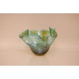 A modern Studio Glass handkerchief style bowl by Peter Layton, 17cm high, in sea blue with amber