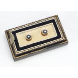 A pair of Art Deco diamond and onyx yellow and white metal octagonal shaped dress studs, the screw