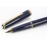A Mont Blanc Generation fountain pen, in blue with gold mounts and having 14ct gold nib