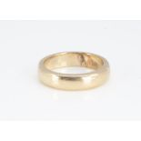 A yellow metal unmarked D shaped wedding band, 4.6mm wide, ring size N, 6.1g