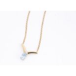 A continental 10k marked aquamarine and diamond necklace, on a flattened gold link chain, 22cm