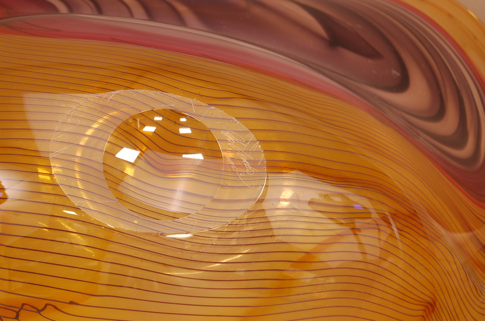 A large Studio Glass Contour Range centrepiece bowl by Bob Crooks, 69cm wide, in amber with greens - Image 3 of 3