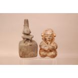 Two pre-Columbian pottery vessels, one in a material similar to basalt modelled with a man sat at