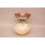 Two modern Studio Pottery bowls, one with abstract flowers to exterior by Harry Horlock Stringer,