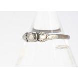 A small diamond solitaire, in silver setting and shank, af, possible ring size M