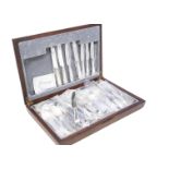 A modern canteen of silver plated cutlery, bead pattern in wooden box, appears unused, and some