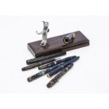 Five vintage fountain pens, including a Watermans, a Parker Junior, a Conway Stewart 388, a Parker