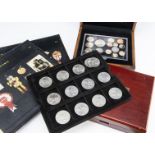 A collection of coins and stamps, including a 2007 and a 2011 UK Executive proof coin sets, a gold